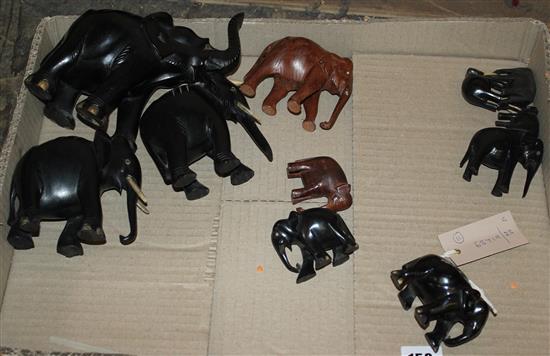 Collection of carved ebony and hardwood small elephants with ivory tusks (faults)